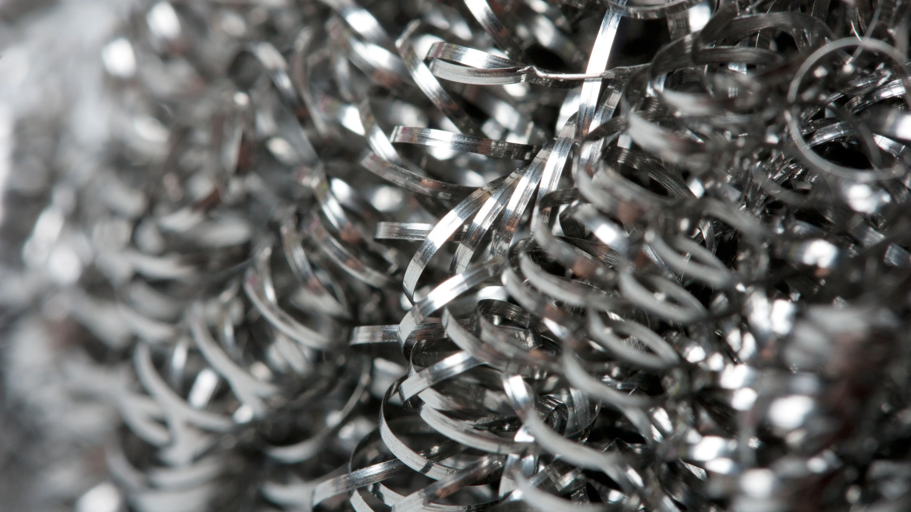 Close-up of coiled metal turnings and machining swarf